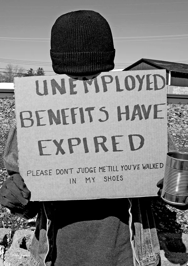 person-holding-unemployment-benefits-have-expired-sign.png