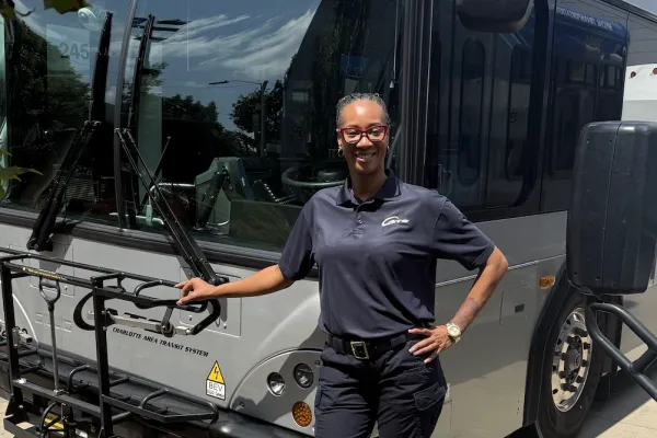 Gia Lockhart in front of a city bus