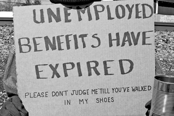 person-holding-unemployment-benefits-have-expired-sign.png