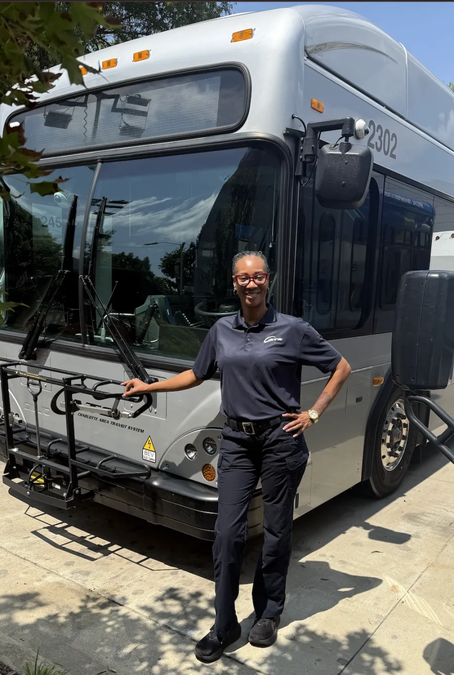Gia Lockhart in front of a city bus